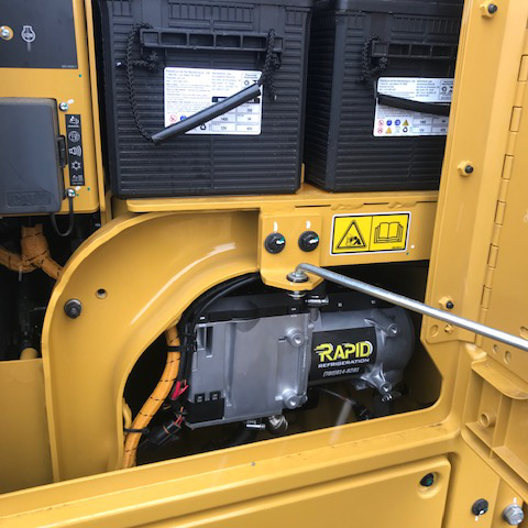 Rapid Refrigeration sticker on espar heater inside a Finning Grader